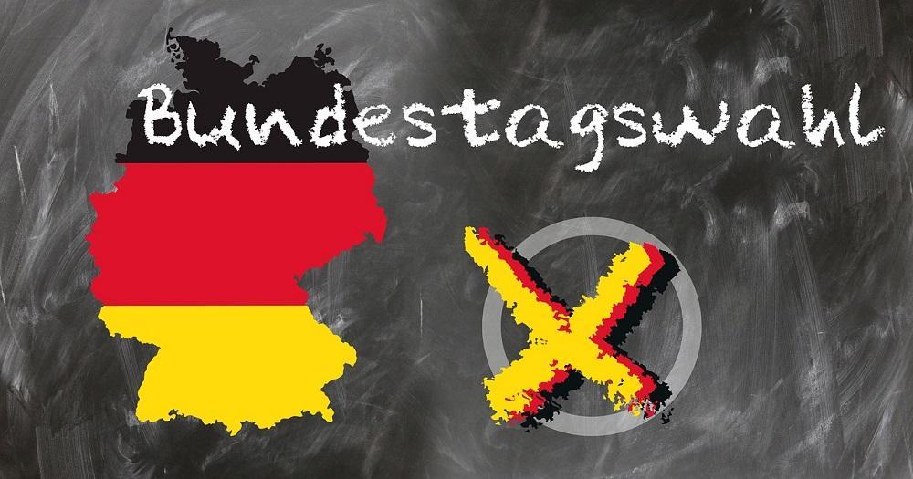 Schriftzug Bundestagswahl und Deutschlandkarte mit Kreuz im Kreis